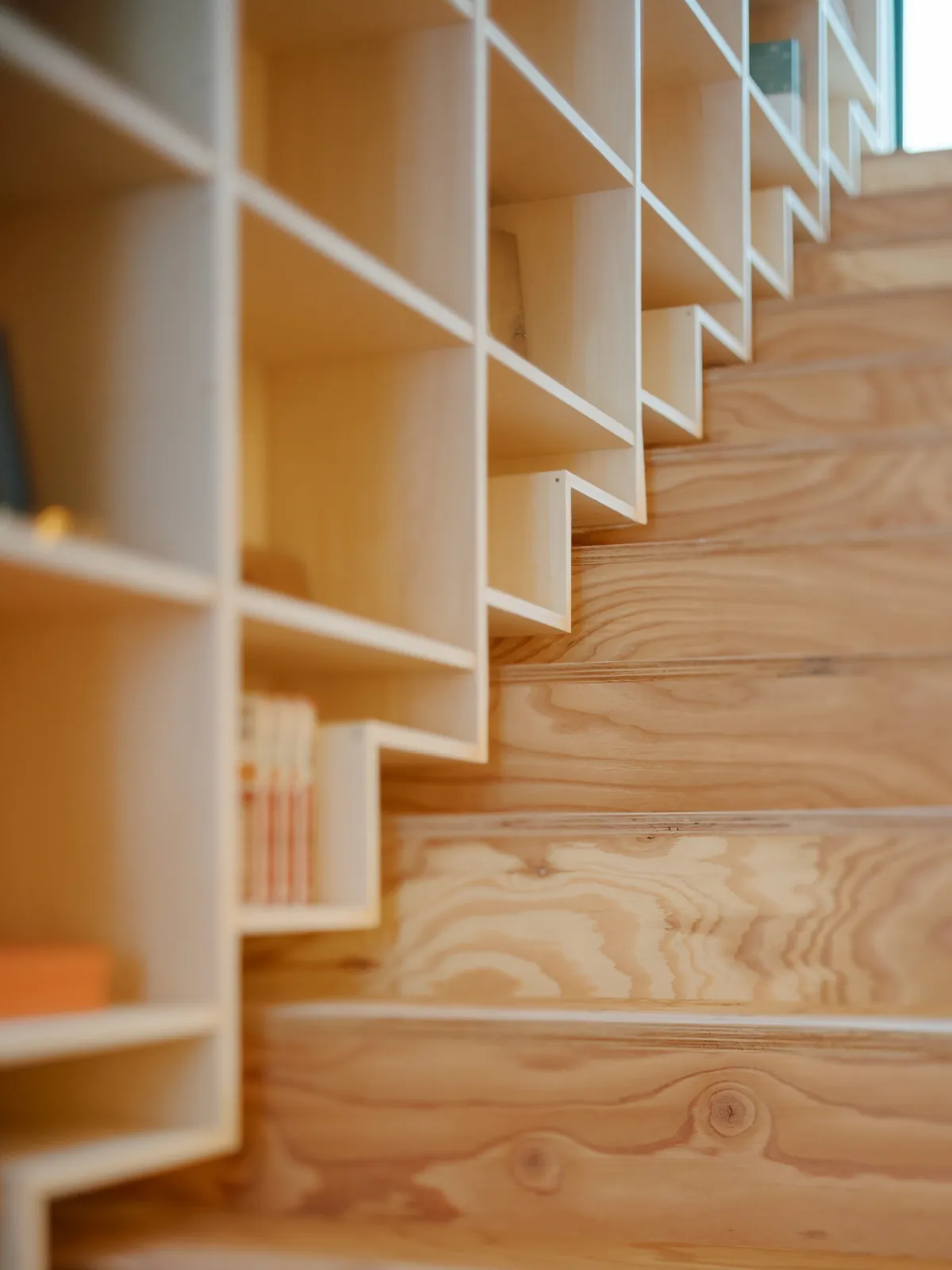 Plywood staircase with built in shelving, AK Housing office, Niseko