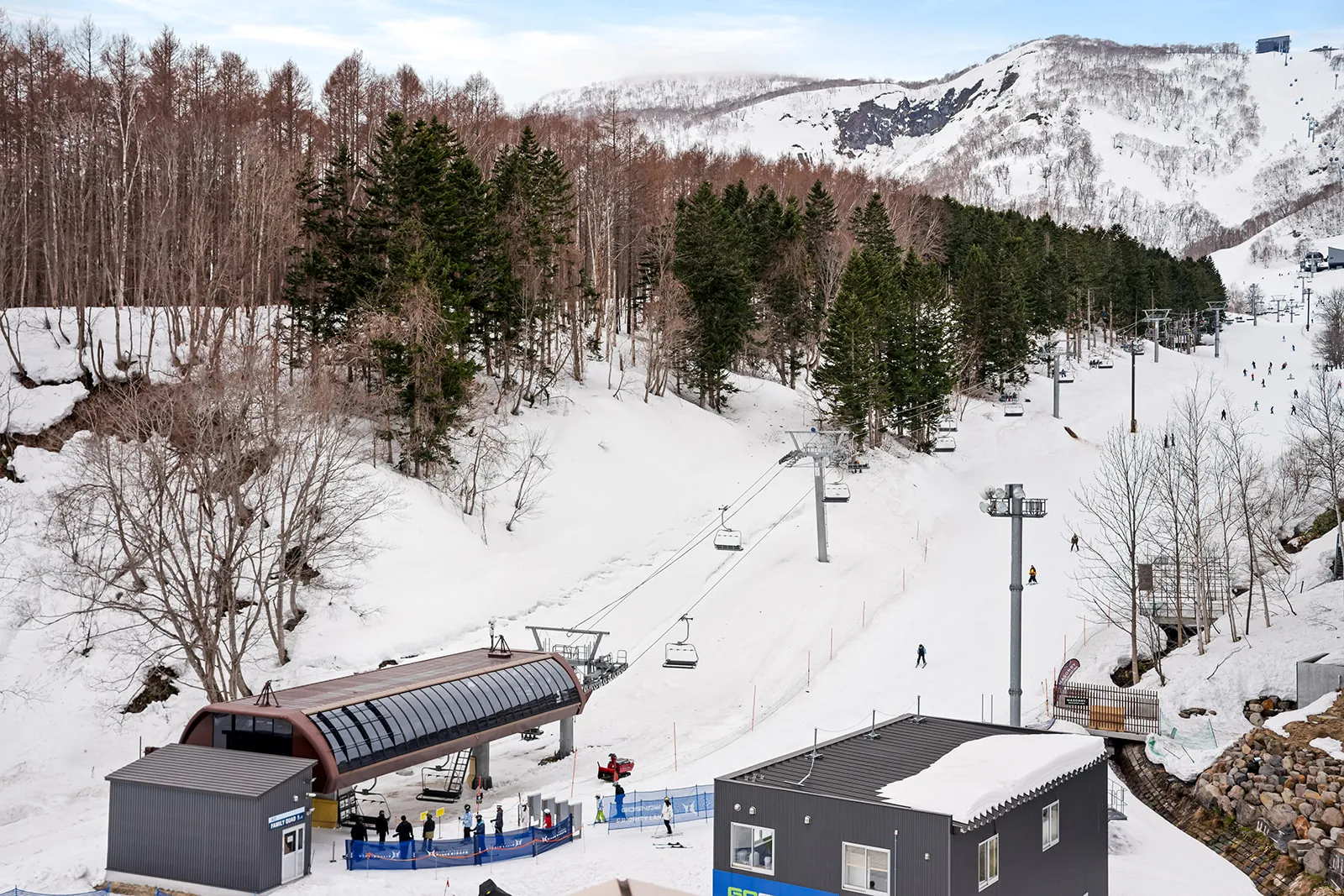 Chairlift and ski run just below Alpen Ridge Hotel Niseko, showing its ski-in ski-out location