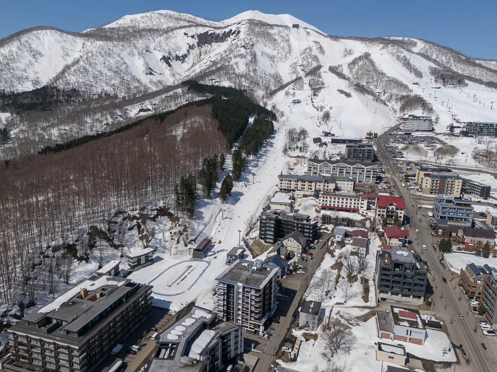 Aerial view over Hirafu village running up to the Grand Hirafu ski runs