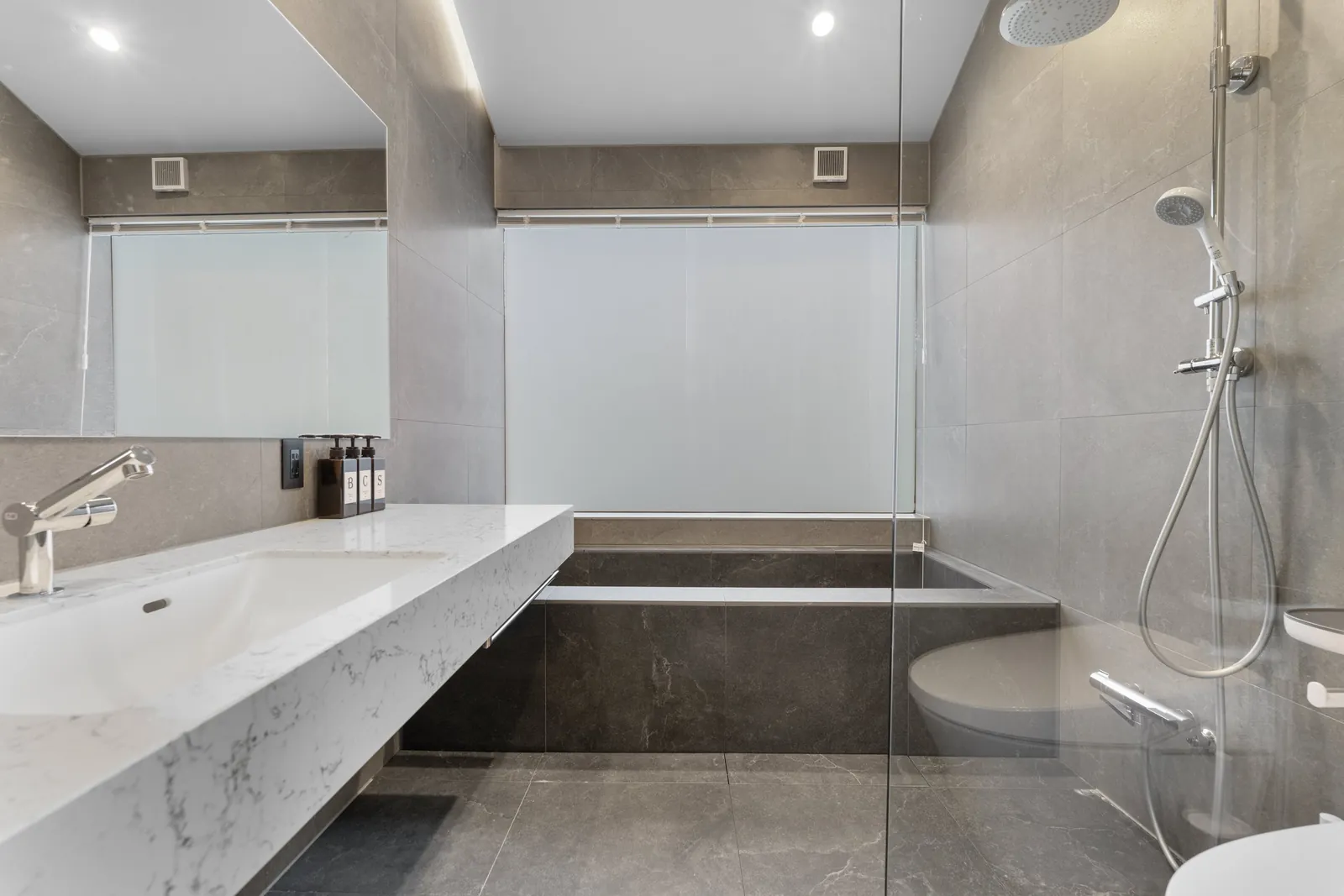 Shower and bath at Aoyama Villa Niseko