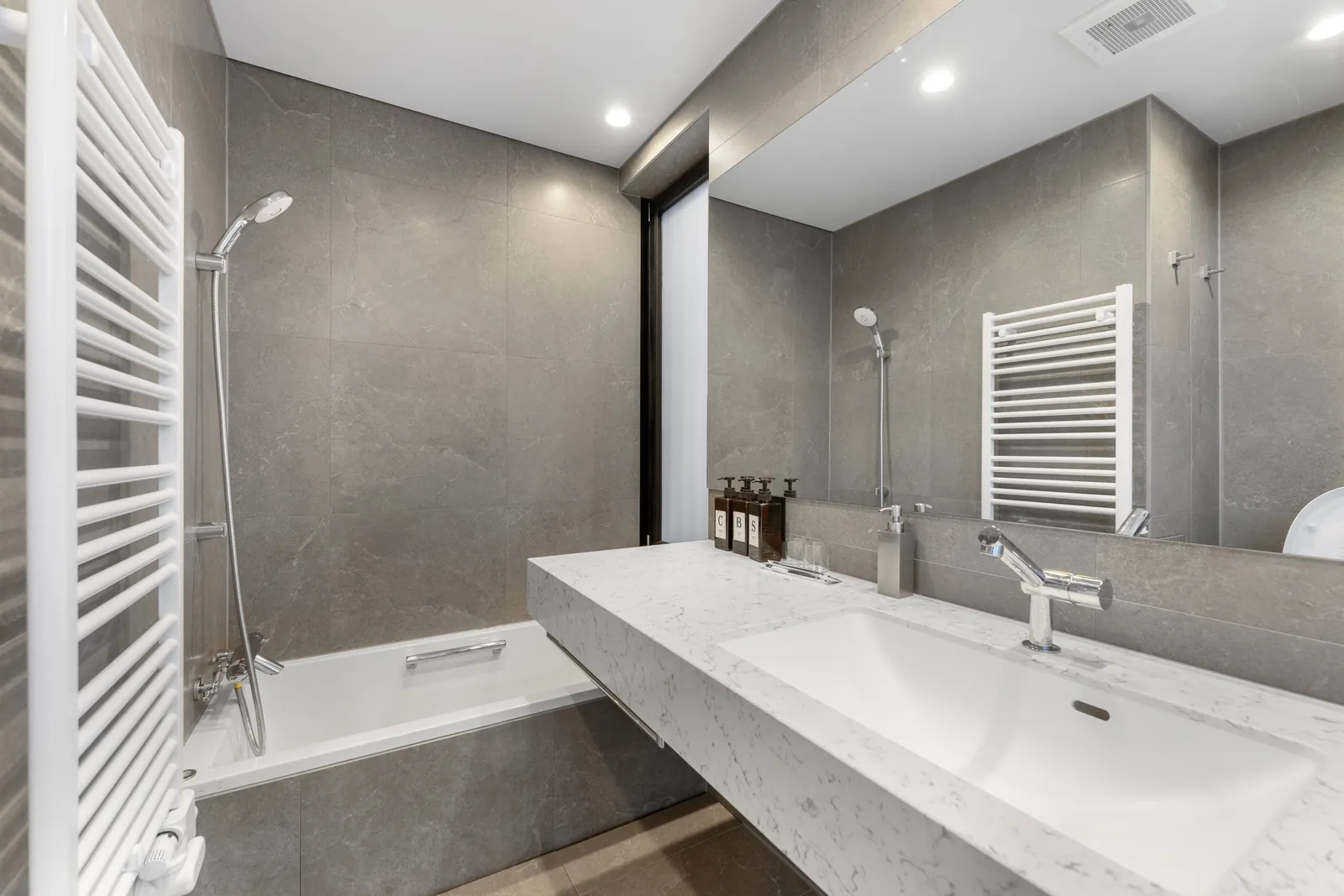 Bathroom with heated towel rail at Aoyama Villa Niseko