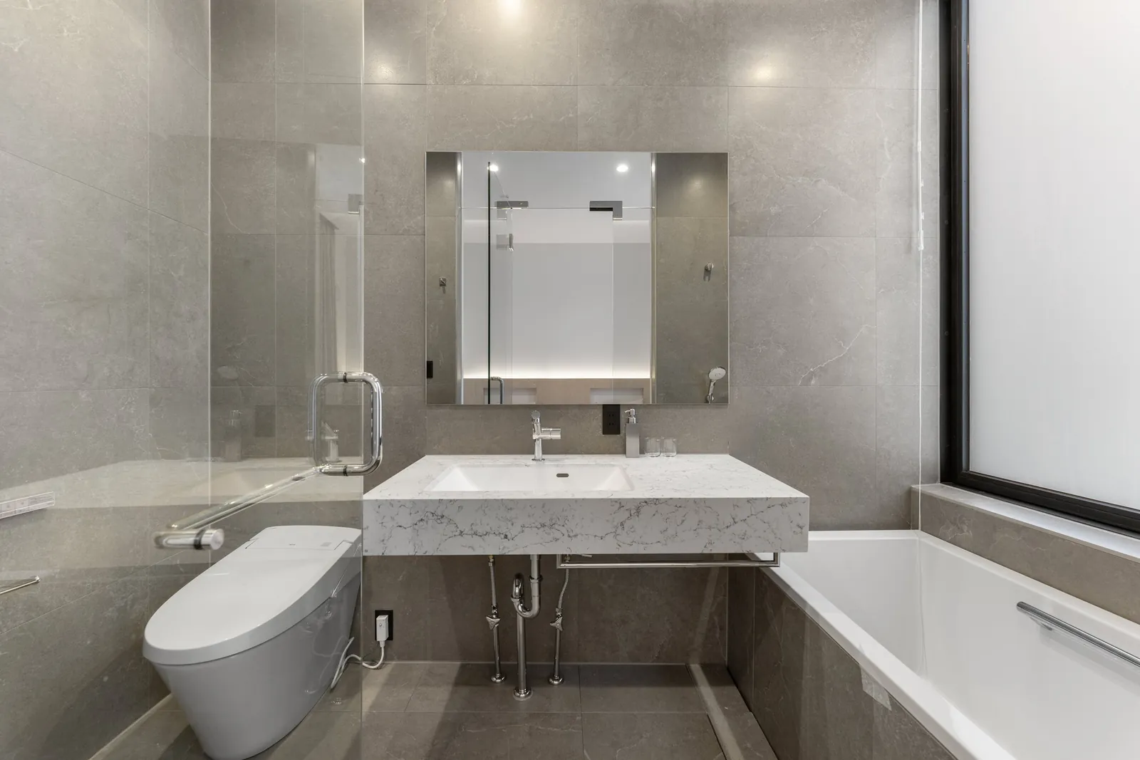 Bathroom vanity and deep bath at Aoyama Villa Niseko