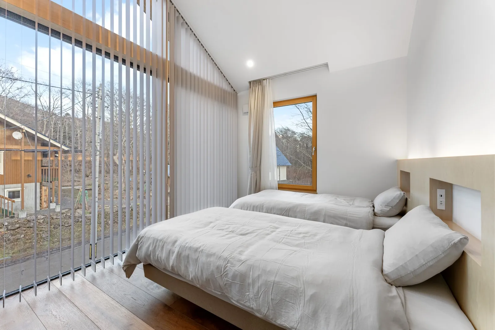 Bedroom with timber louvres at Aoyama Villa Niseko