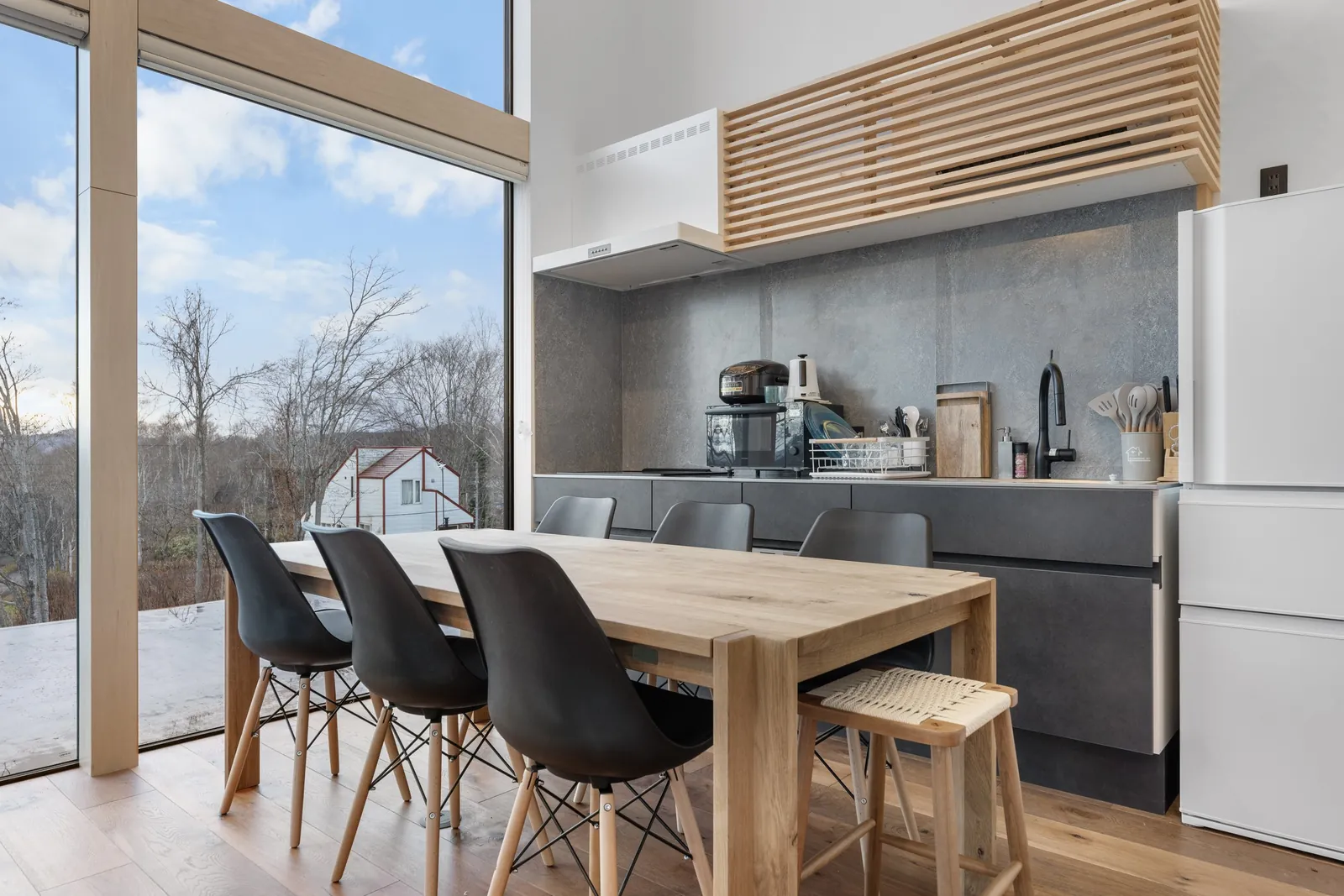 Kitchen and dining table at Aoyama Villa Niseko