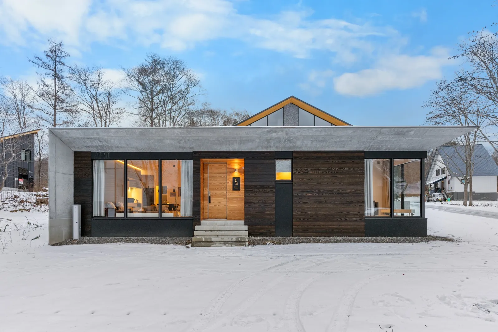 Front of Bisha Niseko with timber entrance