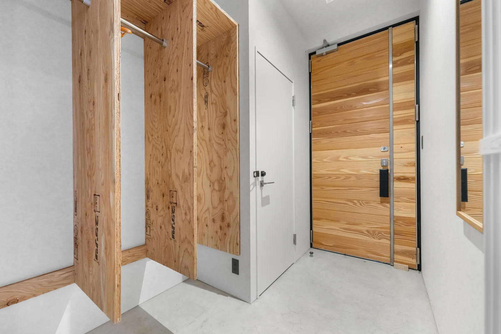Timber entry door and storage at Bisha Niseko