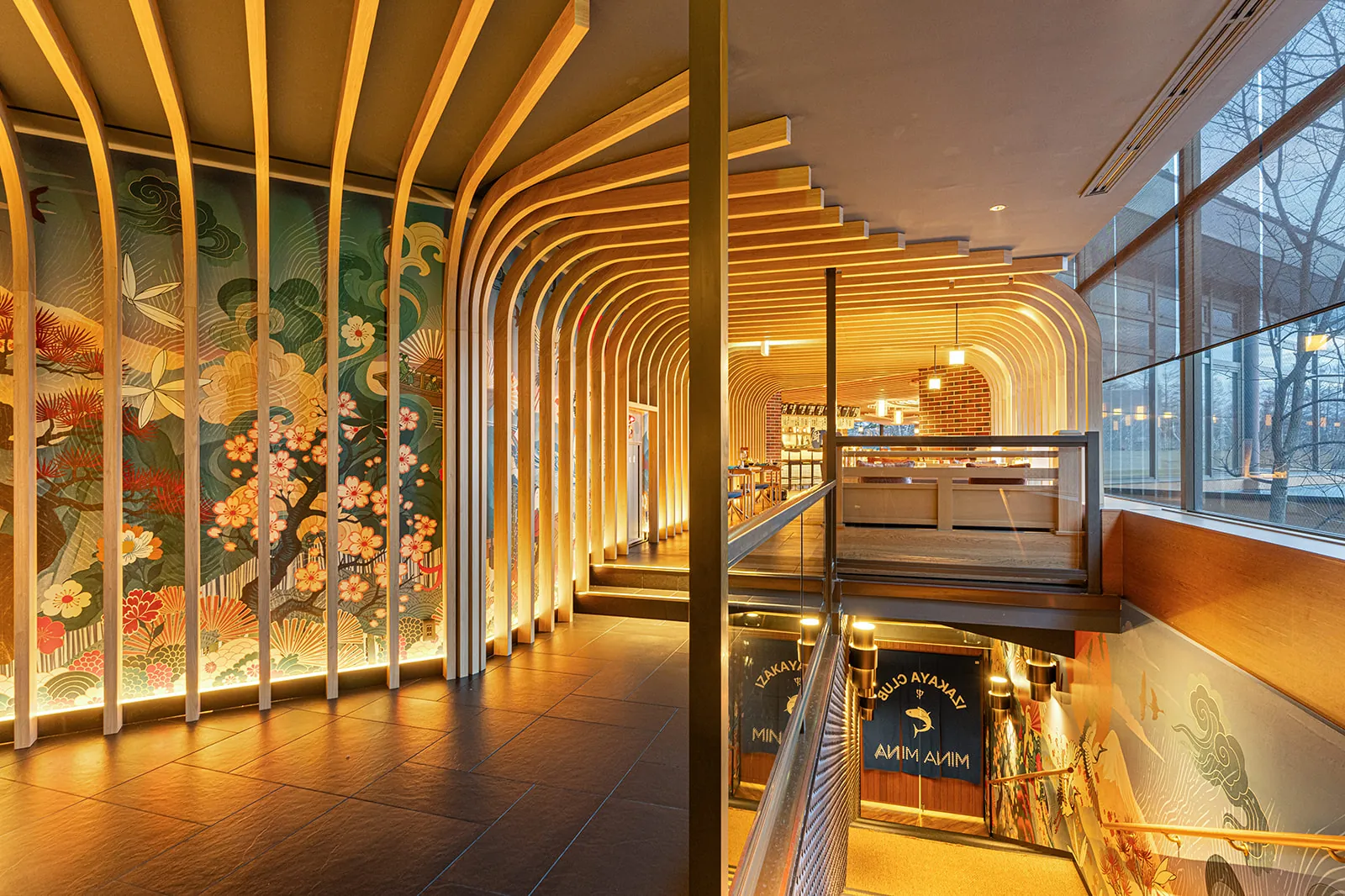 Mina Mina entrance stair lined with a floral mural and lit timber fins, Club Med Sahoro