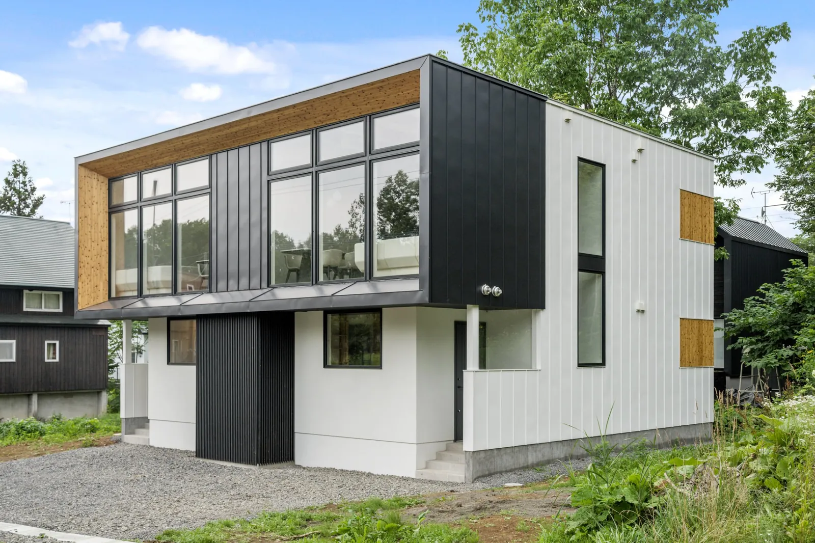 Hikari Hanazaki exterior with timber accents, Niseko