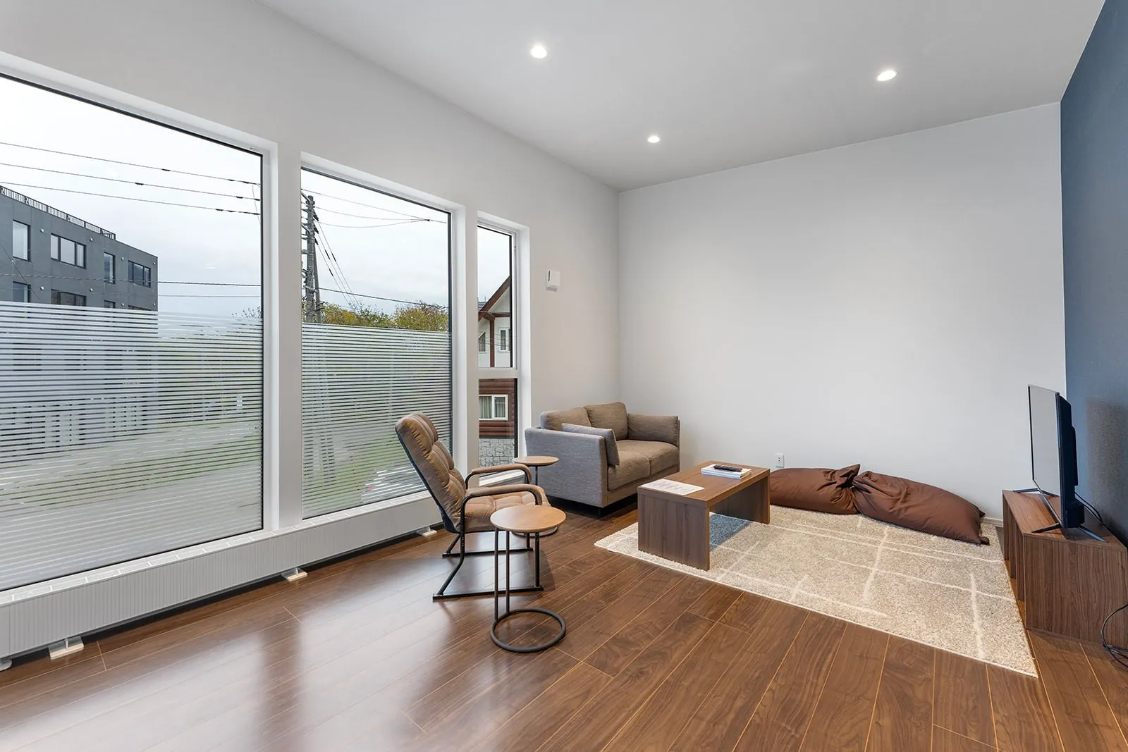 Lounge with armchairs at Hikari House, Hirafu