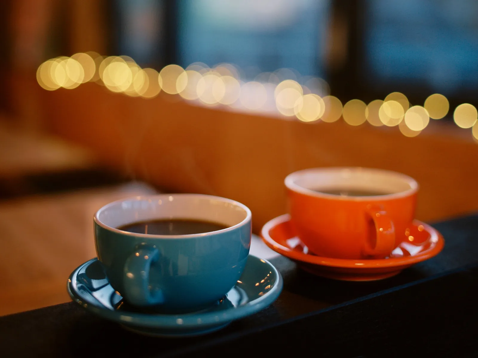 Two coffee cups on the counter at Snowy Cafe Niseko