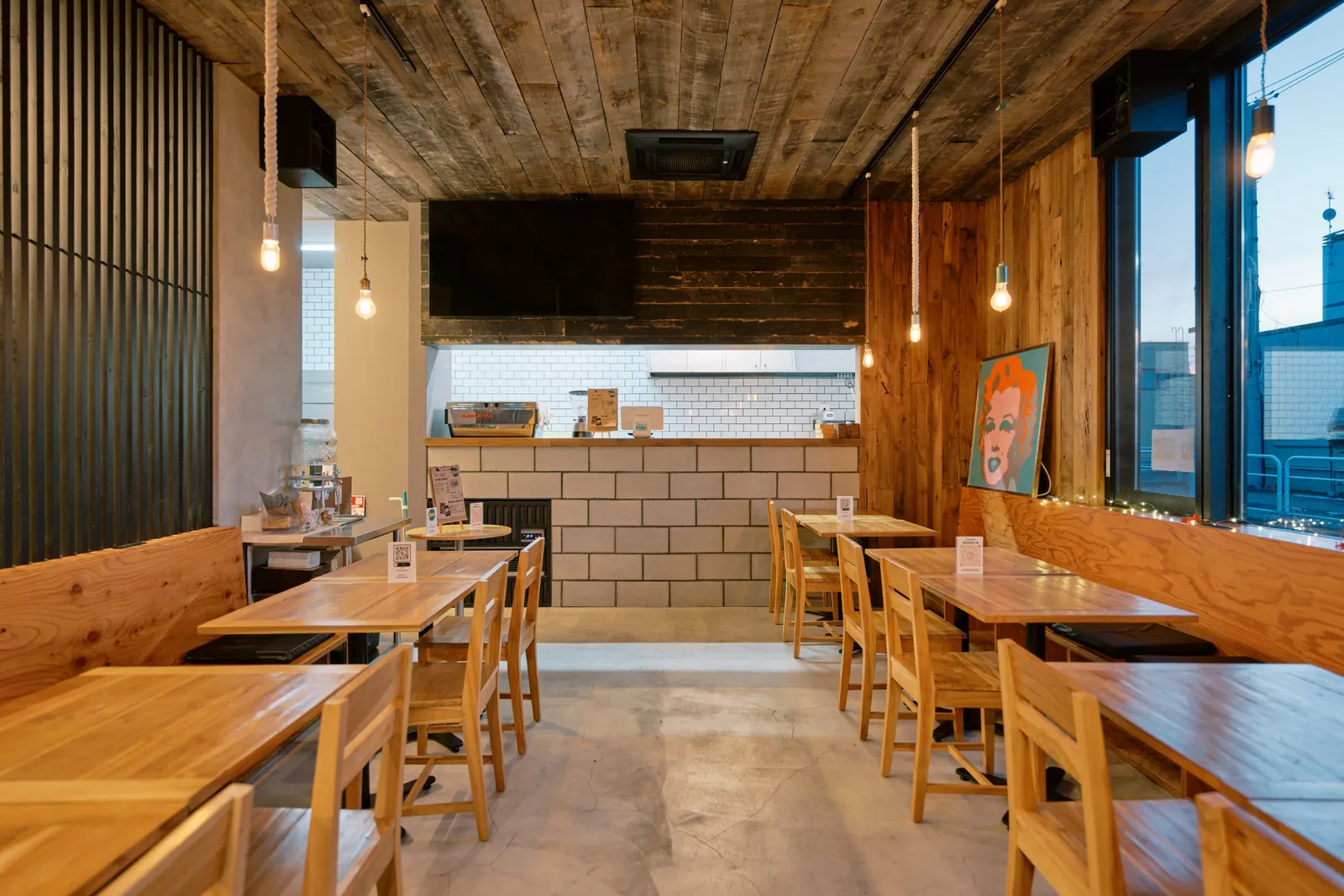 Booth seating and timber ceiling at Snowy Cafe Niseko